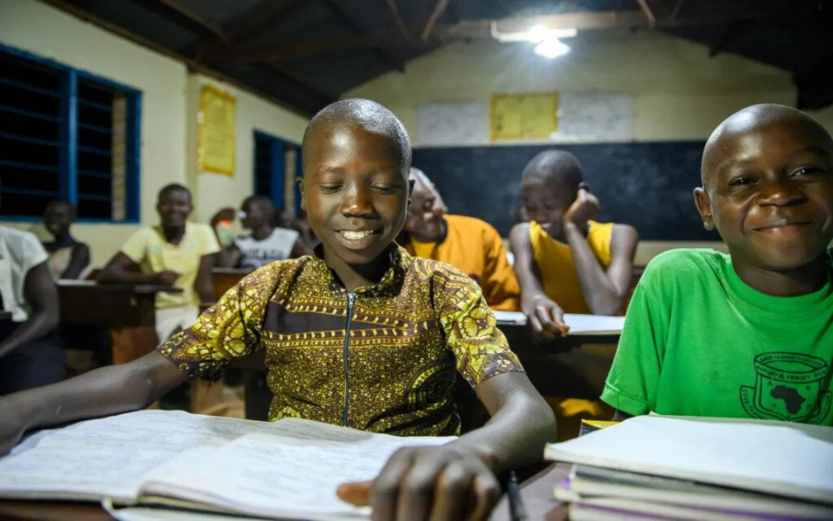 Solar Home Lighting System providing bright LED lighting for students studying in an off-grid rural school classroom